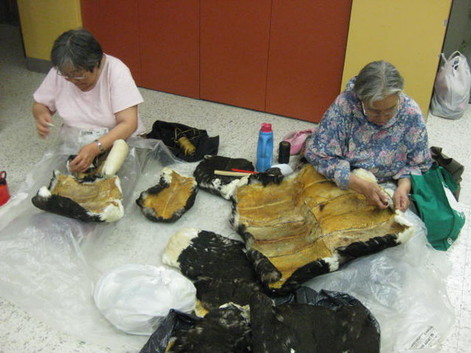 The two ladies sewing are Elisapi Nutaraq and Elisapi Inukpuk